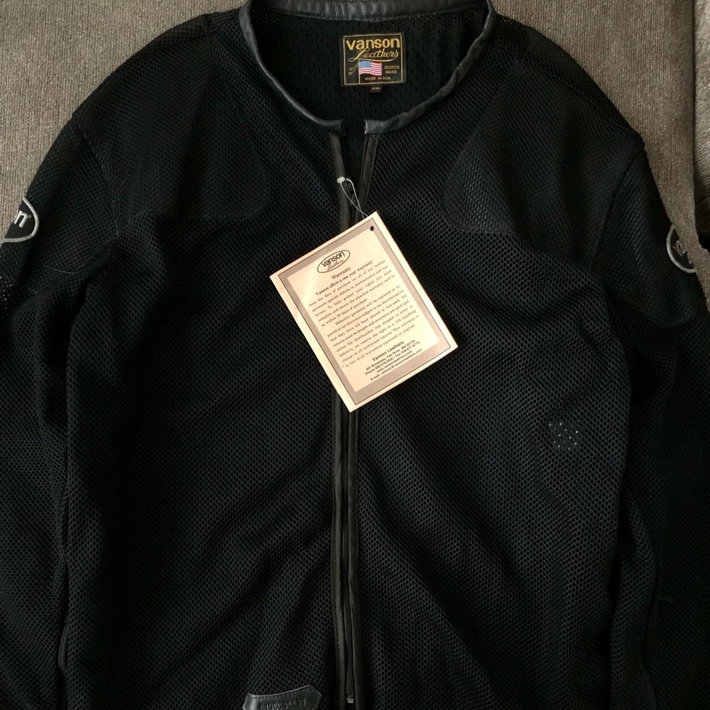 This is a mesh motorcycle jacket with 100% real leather made by Vanson leathers.